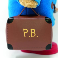 Ours Paddington classique avec bottes et valise