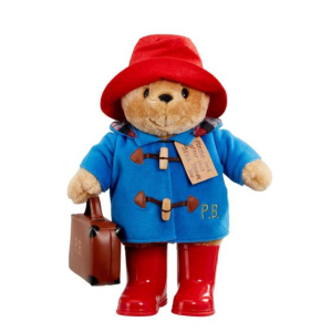 Klassieke beer Paddington met laarzen en koffer